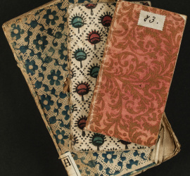 Reliures brochées composées de différents papiers, dominoté et gaufré doré. 18e siècle [Mit. H.7.13], [UU.12°.1072] et [UU.12°.1055]